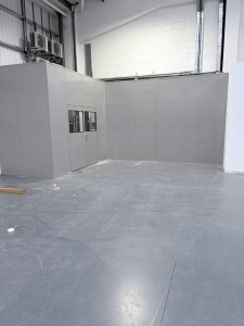 Double skin steel partitioning system installed to create an enclosed area within Clive Sutton’s industrial unit
