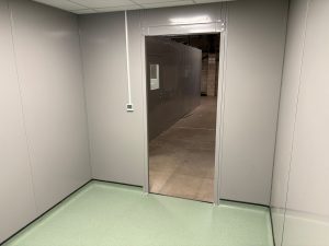 Access opening connecting the clean room partitioning area to the wider industrial warehouse