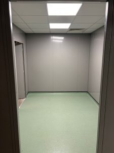 Clean room changing area with double skin steel partition walls, suspended ceiling and safety vinyl flooring