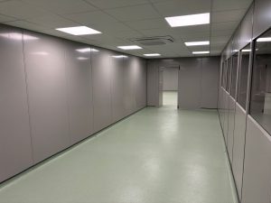 Clean room corridor formed with double skin steel partitioning and glazed viewing panels
