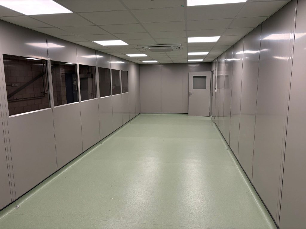 Internal clean room area with double skin steel partitioning, access door and LED lighting