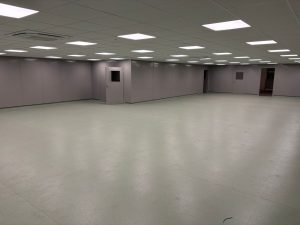 Completed clean room with double skin steel partitioning, suspended ceiling, LED lighting and safety vinyl flooring